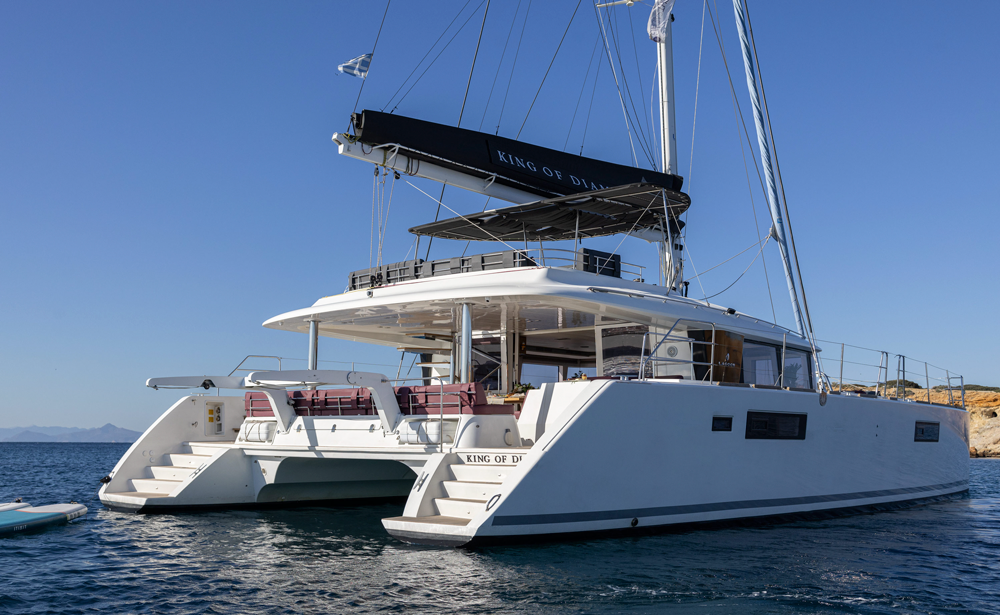 Catamaran at anchor in a quiet bay