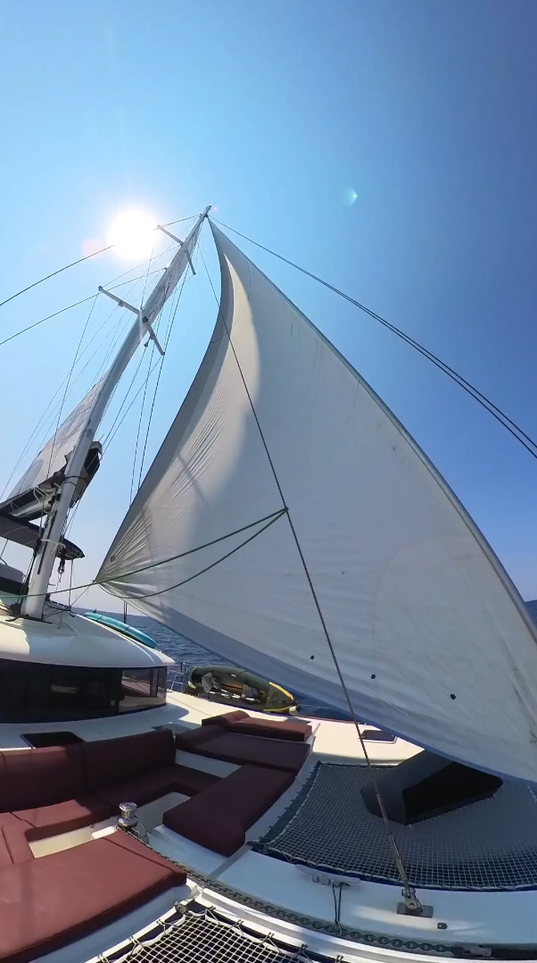 Catamaran sailing under full sail